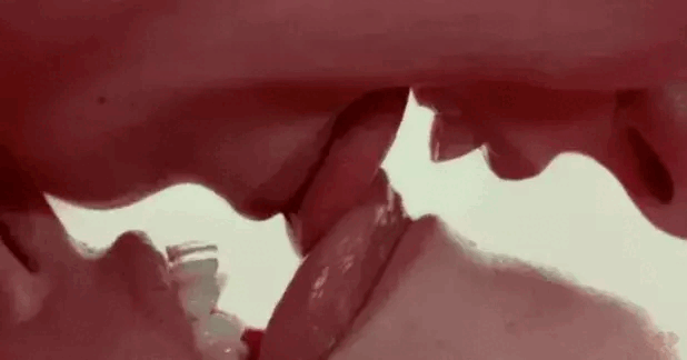 You lean over her face and rub your tongue firmly against hers, and then give her a hot kiss.
