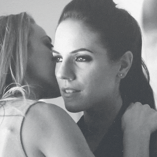 You get closer, your lips just an inch away from her ear as you whisper something to her. Maybe something dirty, maybe something sexy or maybe even something cute. That's for the two of you to know and everyone else to wonder.
